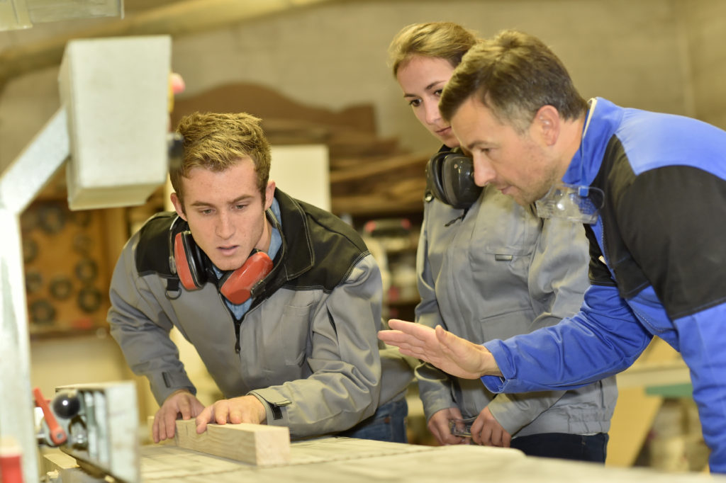 Group of students in woodwork training course